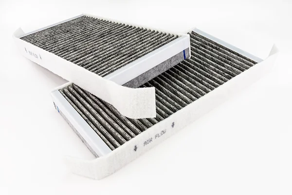 Two clean cabin air filters isolated on grey background